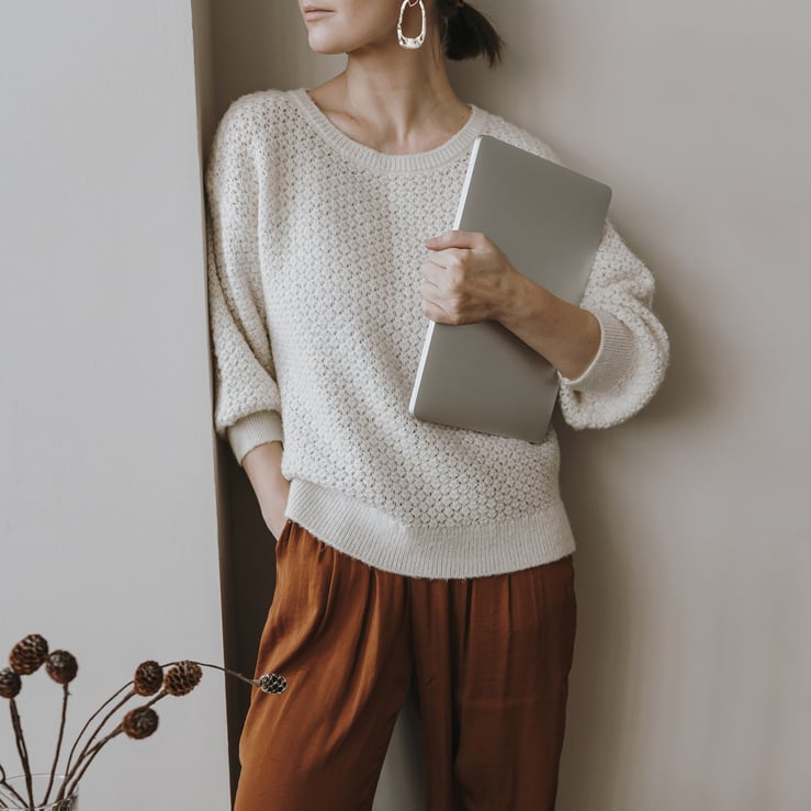 Woman Holding Laptop at Home