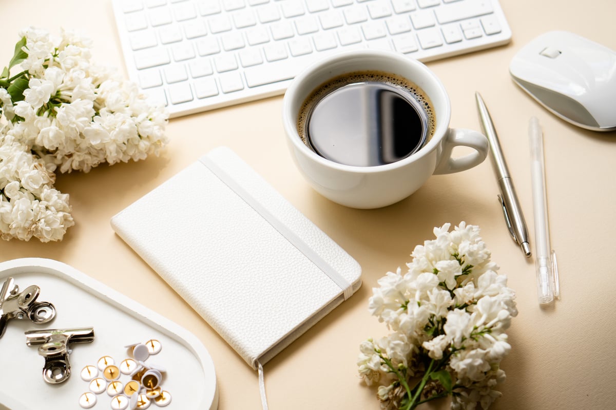 Keyboard and Mouse with Cup of Coffee on Neutral Background